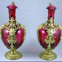 Pair of Ruby Red pitchers with gilt spelter mount
